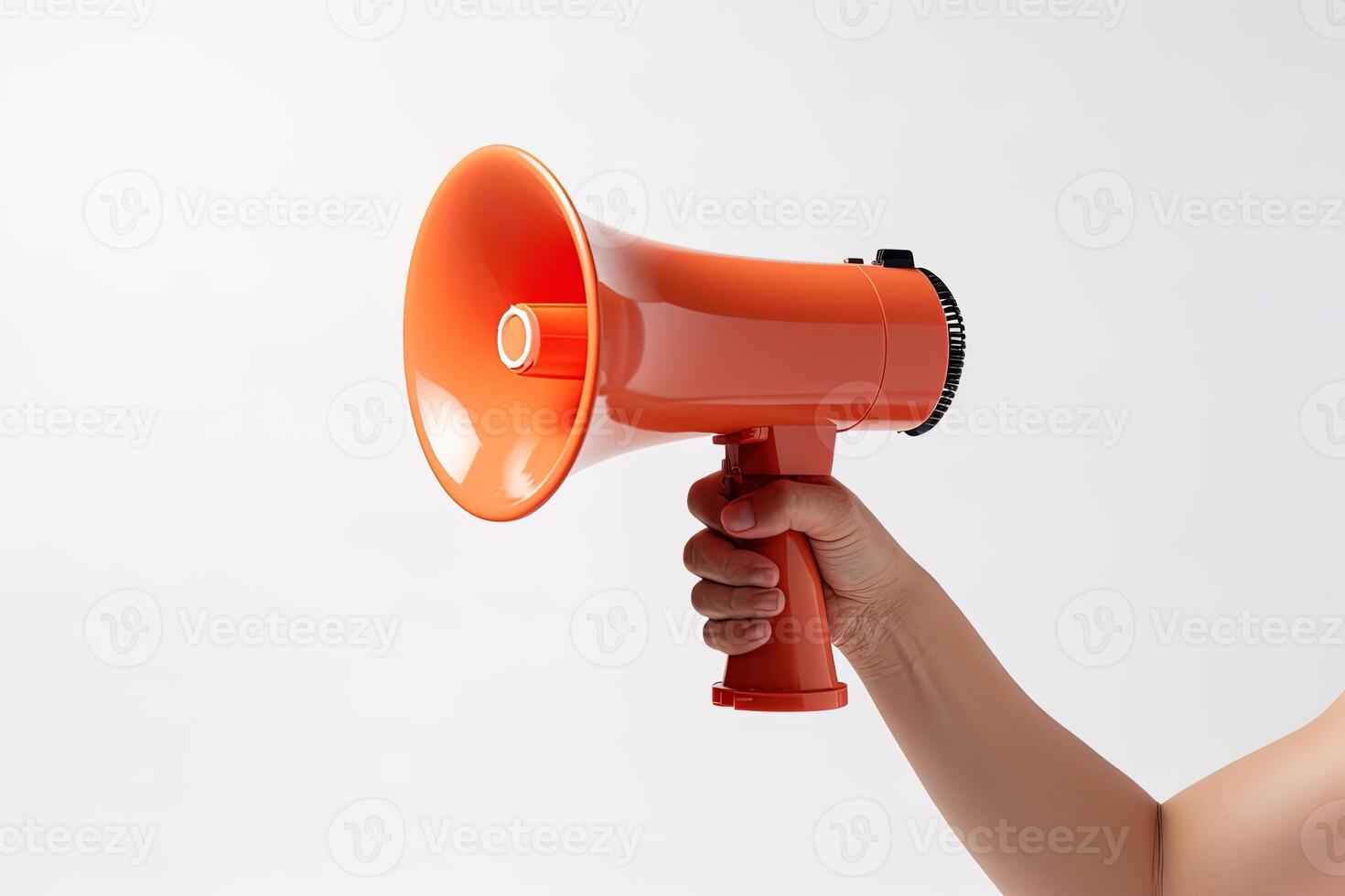 The hand holds a blue megaphone on a orange background. Announcement concept. Shout It Out. photo