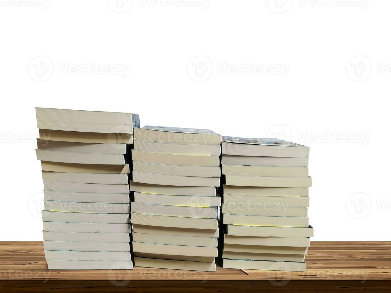 stack of books on wooden table isolated on white background photo