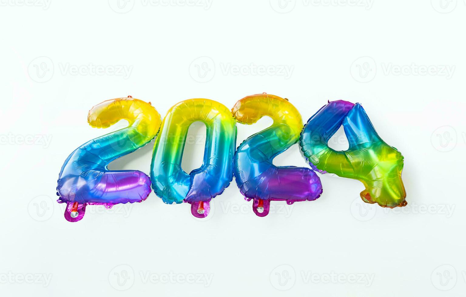 2024 New Year concept by rainbow foil balloons numbers. photo