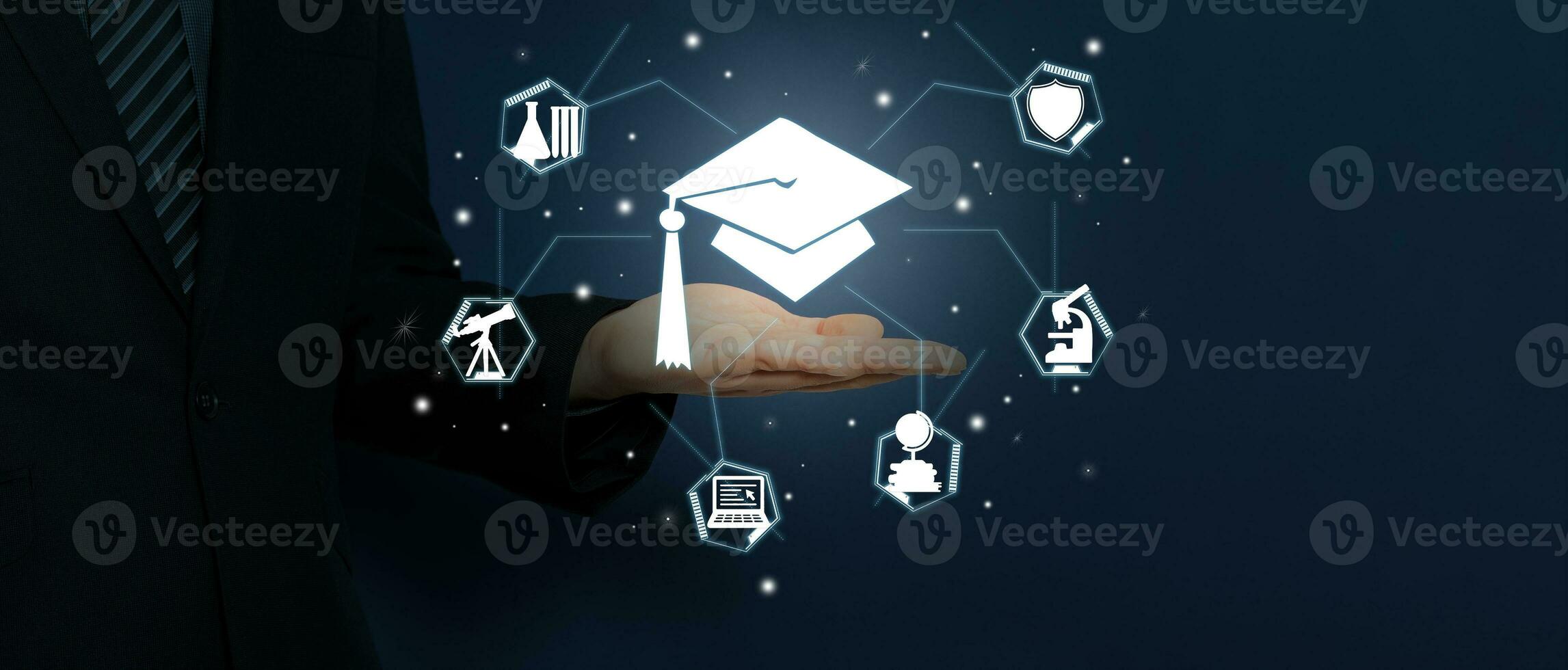 Businessman hand show education insurance icon design isolated on dark blue background. photo