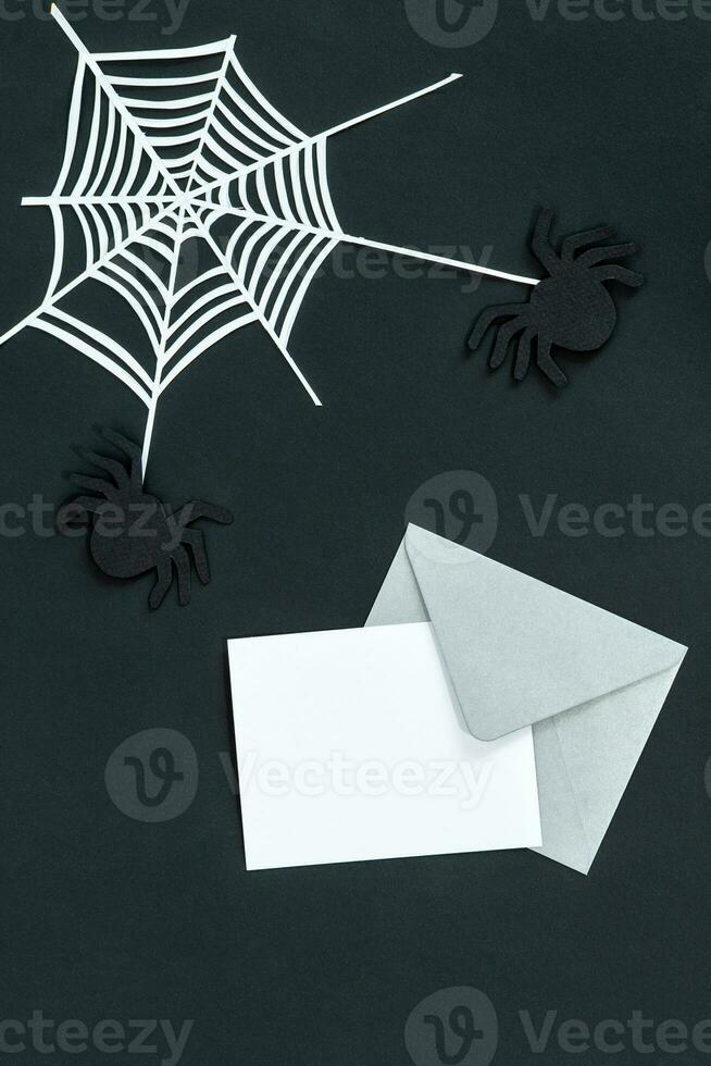 Halloween holiday invitation with spider and spider web on black background. photo