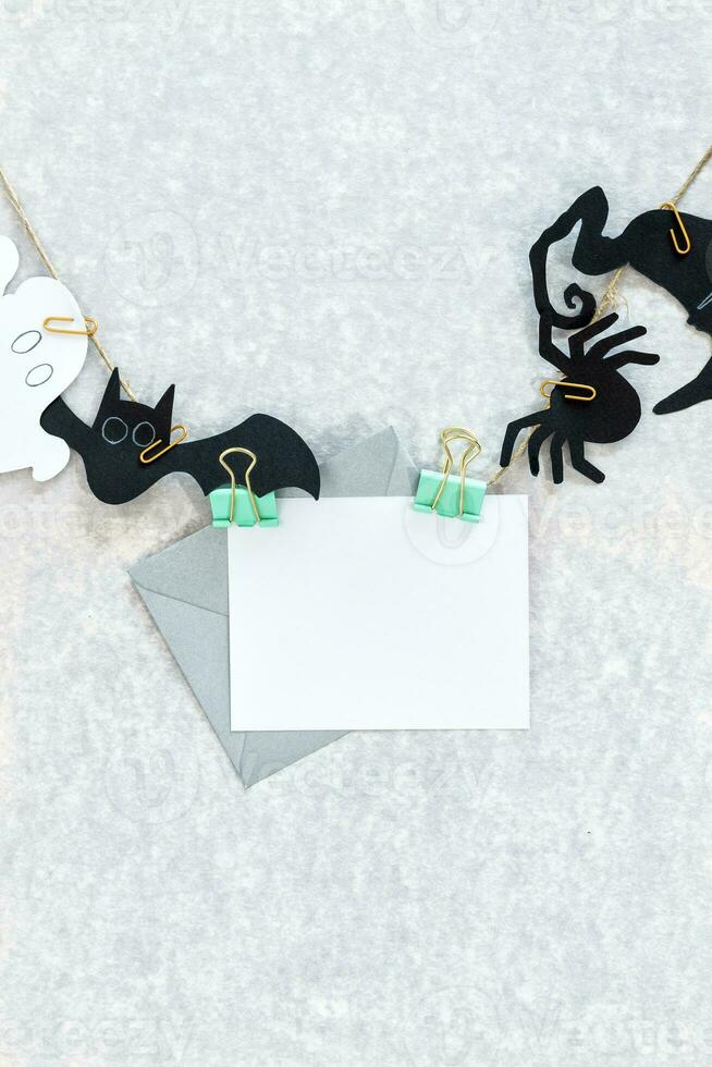 Halloween holiday background with decorations on gray background. View from above. photo