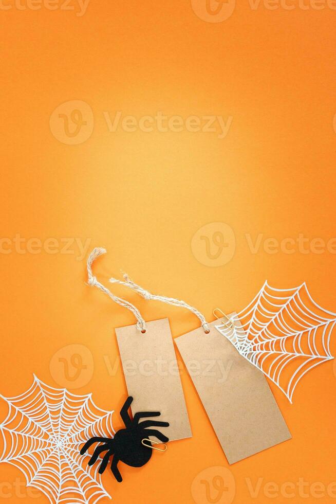 Halloween sale banner with labels and spider on orange background. photo