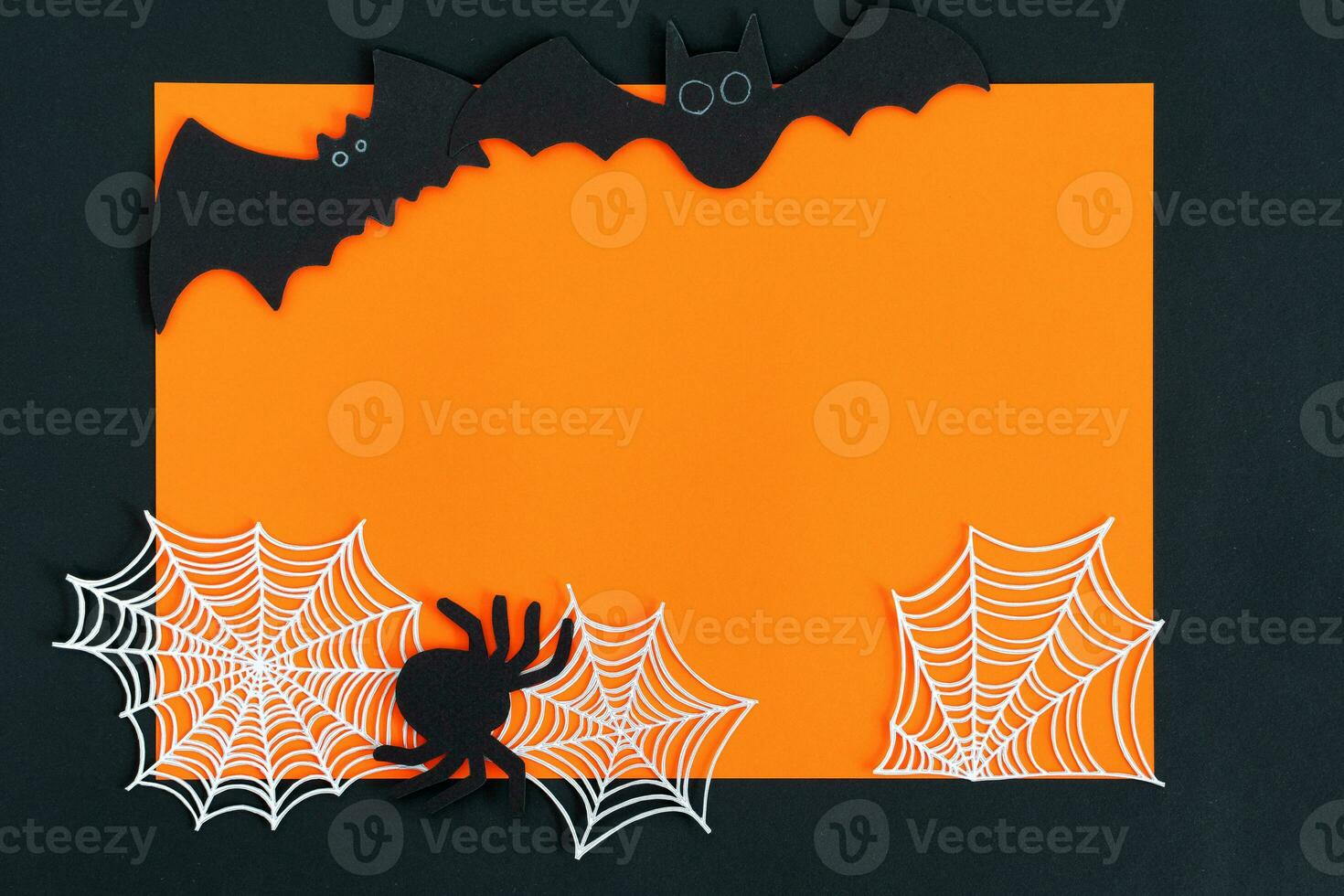 Halloween decorations on orange background. Halloween concept. Flat lay, top view, copy space. photo