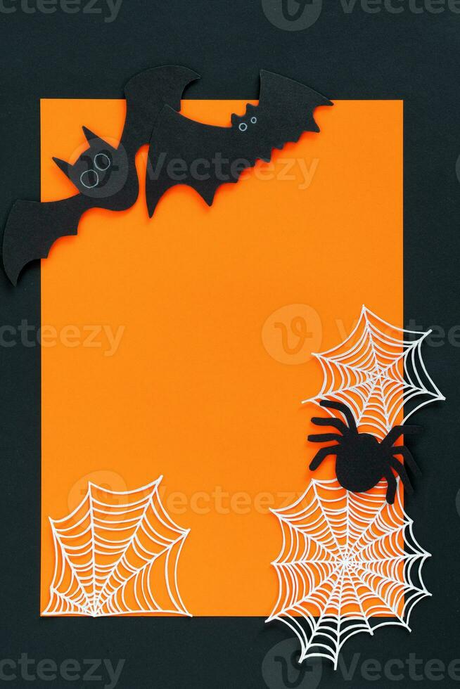 Halloween decorations on orange background. Halloween concept. Flat lay, top view, copy space. photo