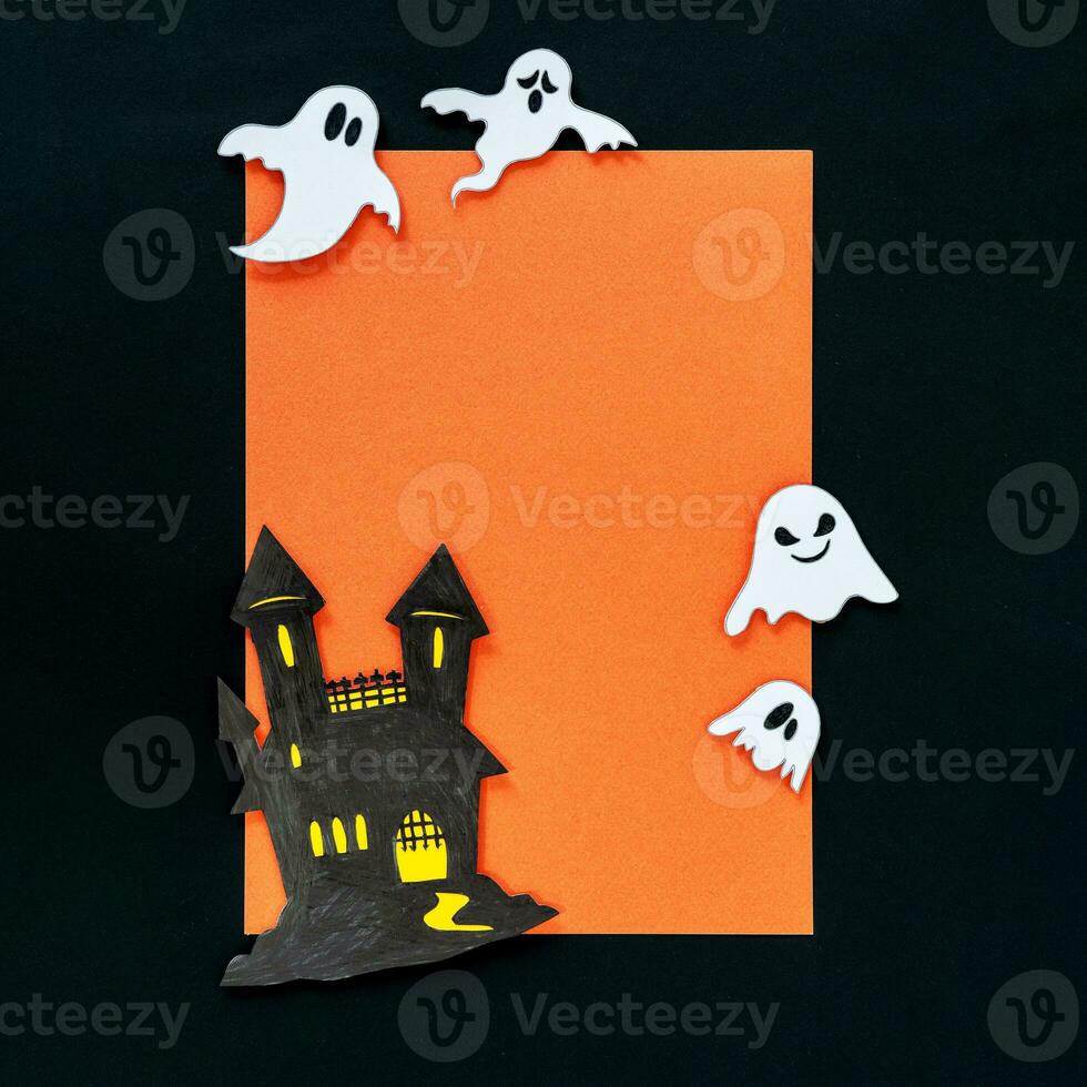 Scary halloween ghosts and castle, on orange and black background. photo