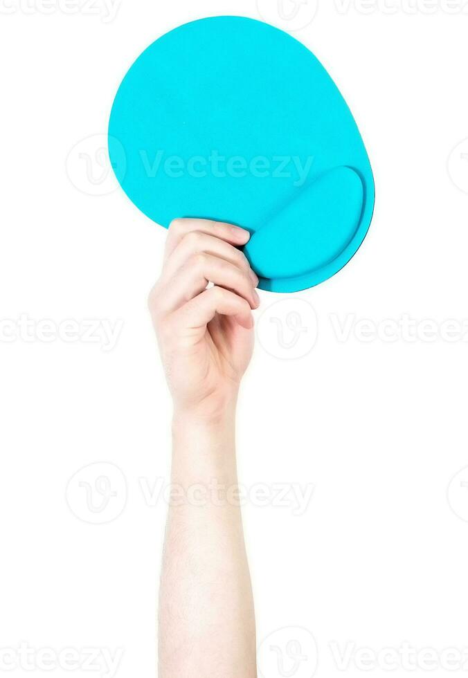 Man's arm raised holding a mouse pad. Technology concept. Isolate on white background. photo