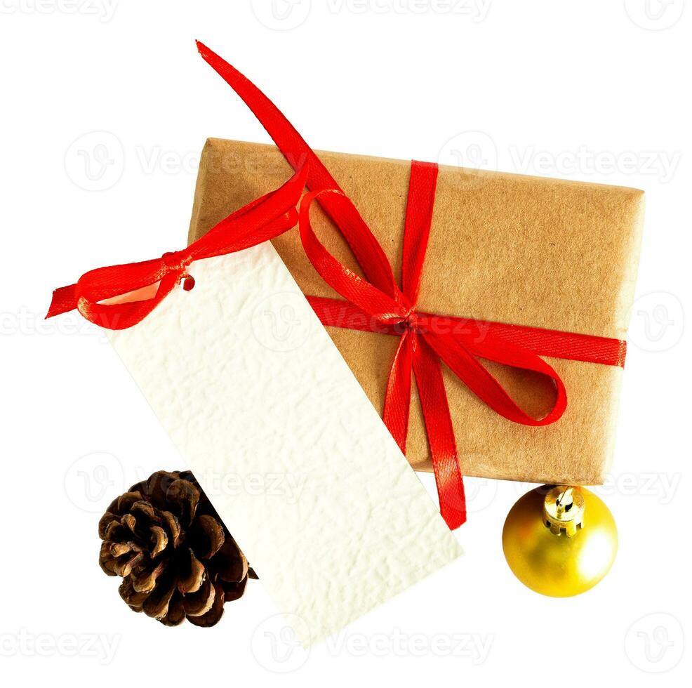 Christmas gift box decorated with red ribbon, label, on white or transparent background. Christmas and New Year. photo