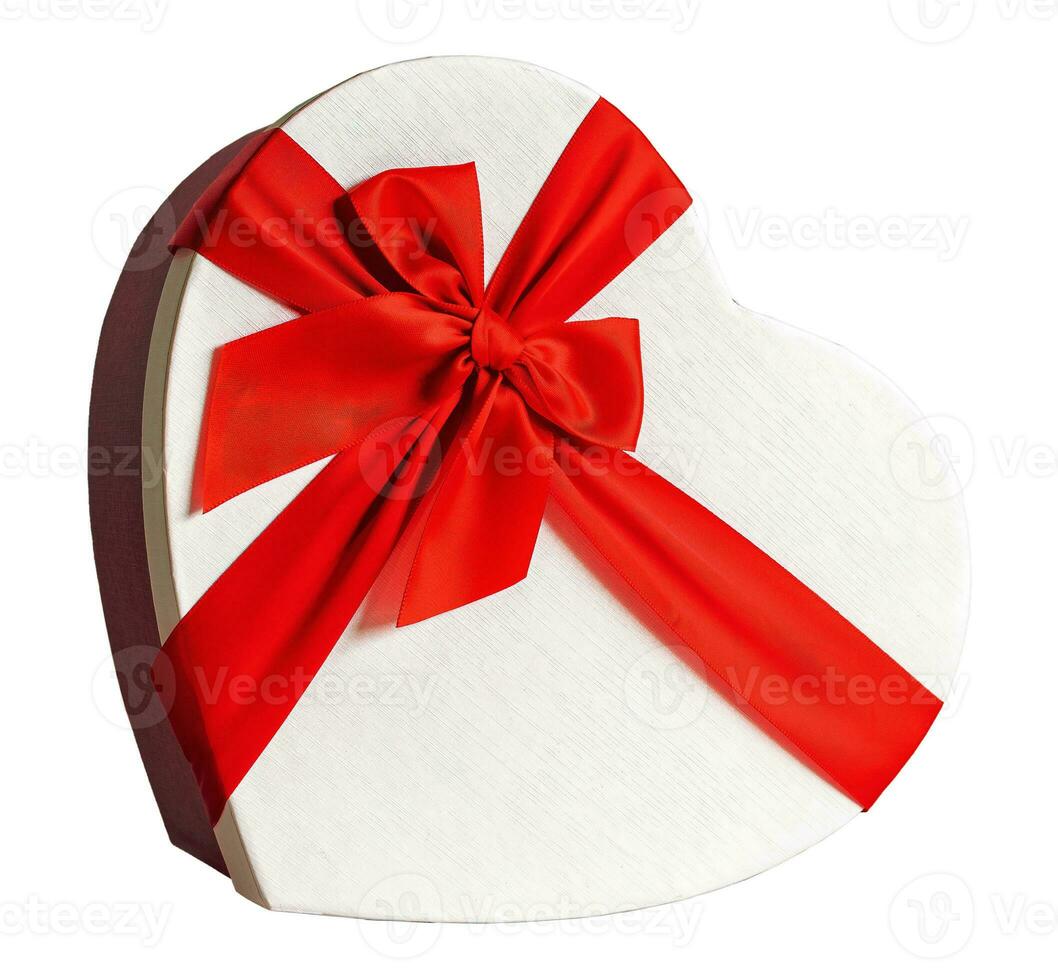Side view heart-shaped gift box and a red ribbon on a blank background. photo