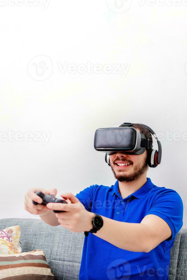 Bearded man using the virtual reality headset and controller. photo