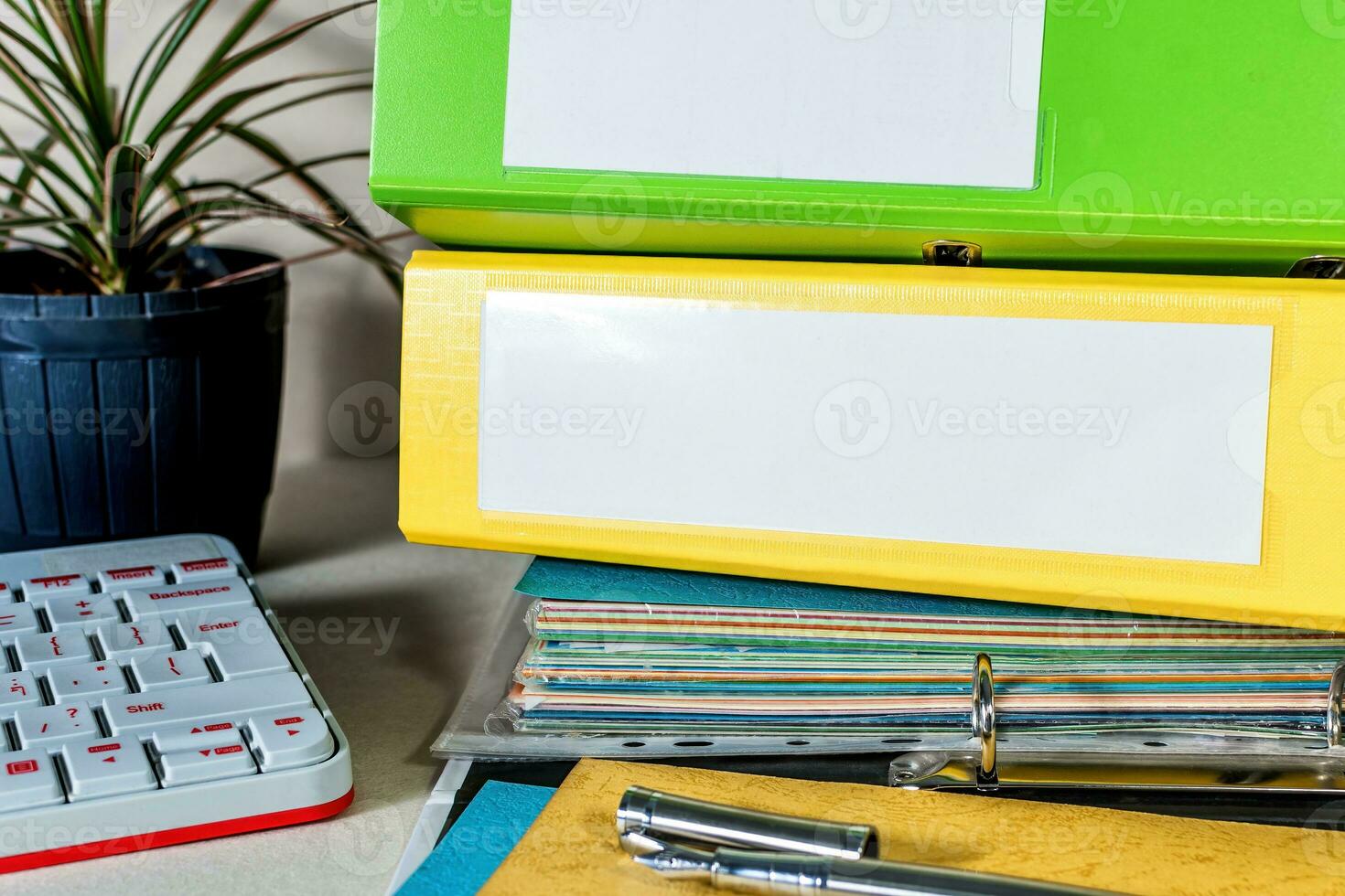 Folders and keyboard on desk. Business and education background. photo