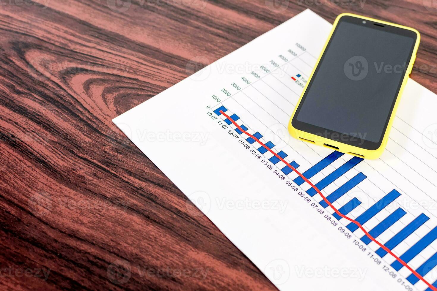 Statistical reports on wooden table. photo