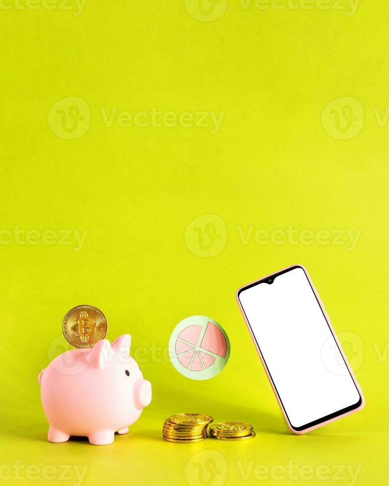 Piggy bank on smart phone and bit coins. Savings concept. photo
