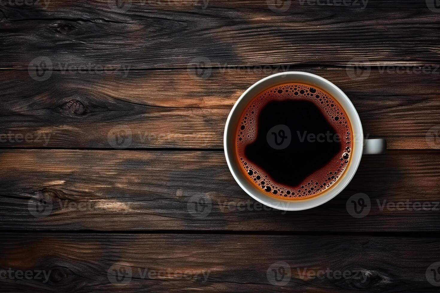 Cup of coffee on wooden background. Top view with copy space. photo