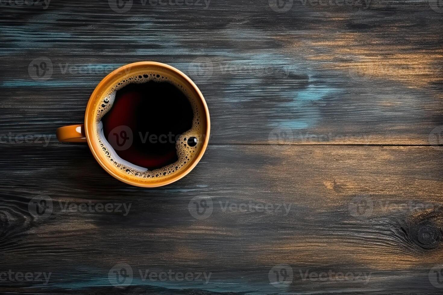 Cup of coffee on wooden background. Top view with copy space. photo