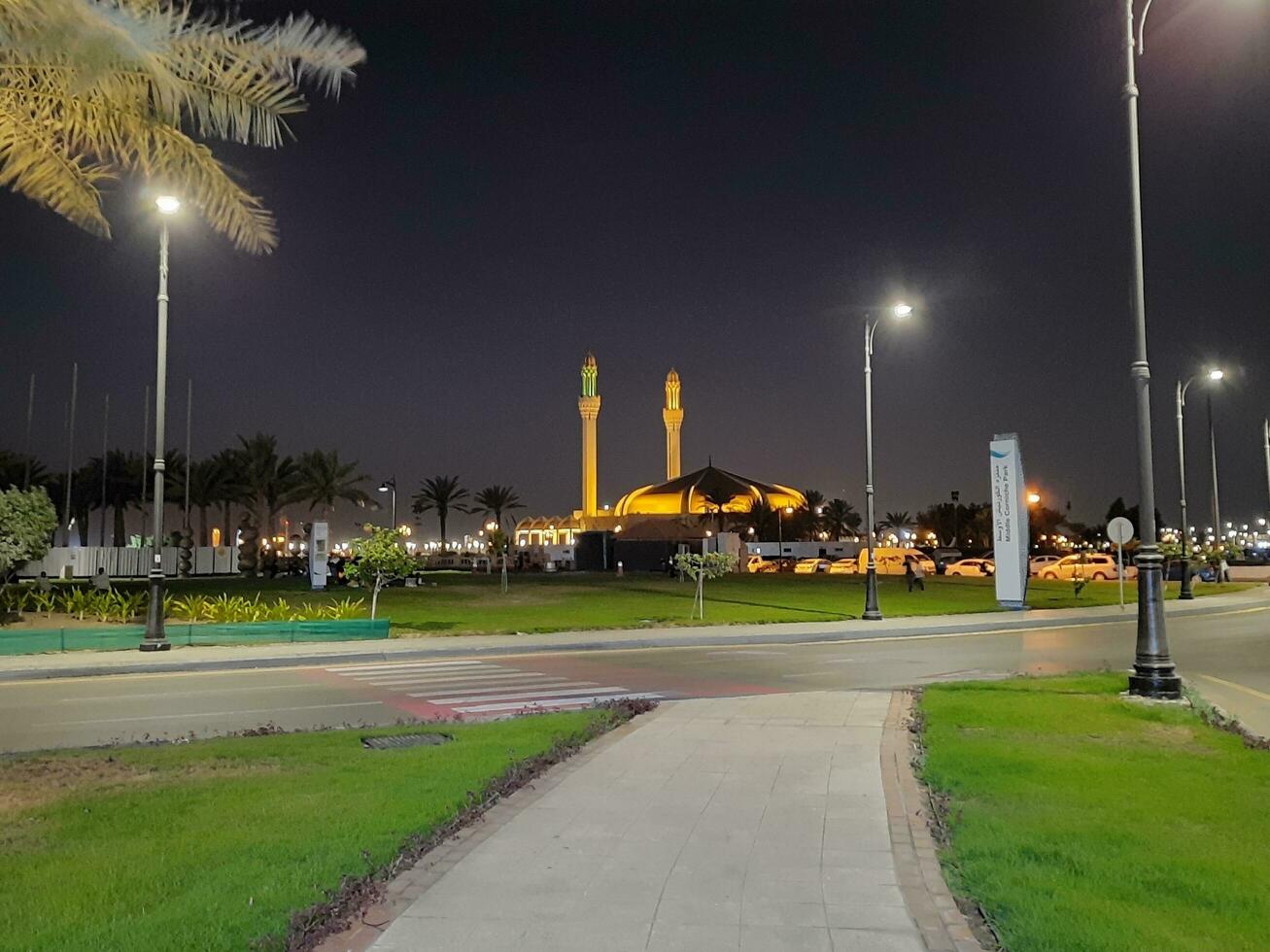 Jeddah, Saudi Arabia, June 2023 - A beautiful night view of the minarets and dome of the Hassan Enany Mosque on the Jeddah Corniche. photo