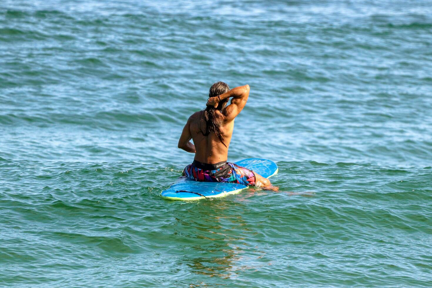 Rio de Janeiro, RJ, Brazil, 05.08.2023 - Surfers riding waves on Arpoador Beach, Ipanema photo