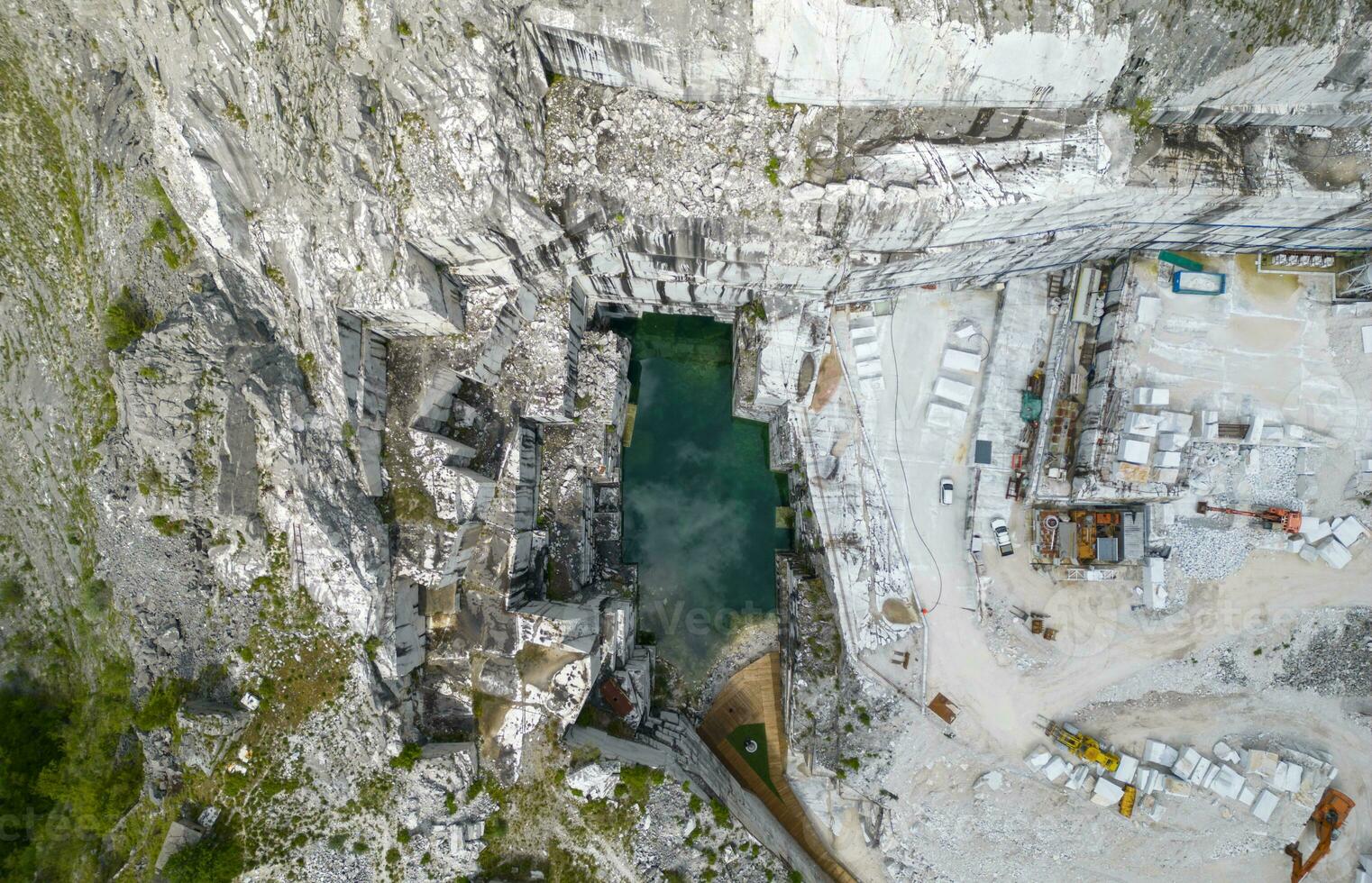 Aerial view of the blue lake of the marble quarry Valsora Massa Carrara Tuscany Italy photo