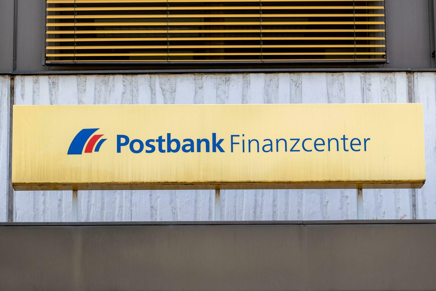 Schwetzingen, Germany - May 28, 2023 a german bank with the lettering postbank finance center photo