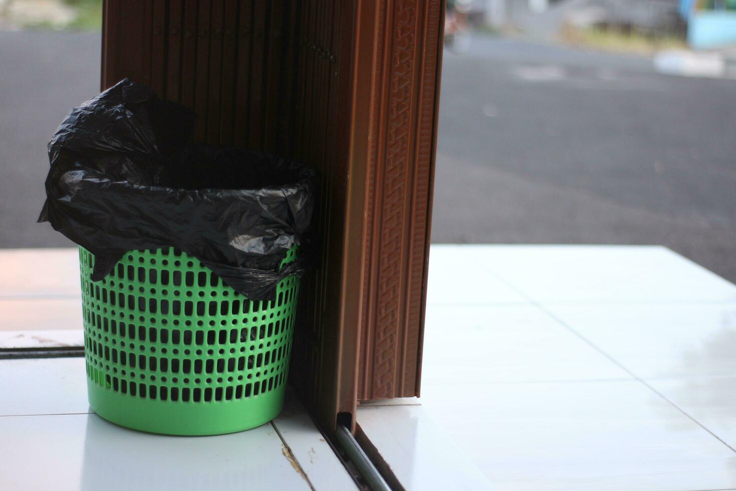 Trash baskets are placed in the corner of the shop to maintain cleanliness. photo