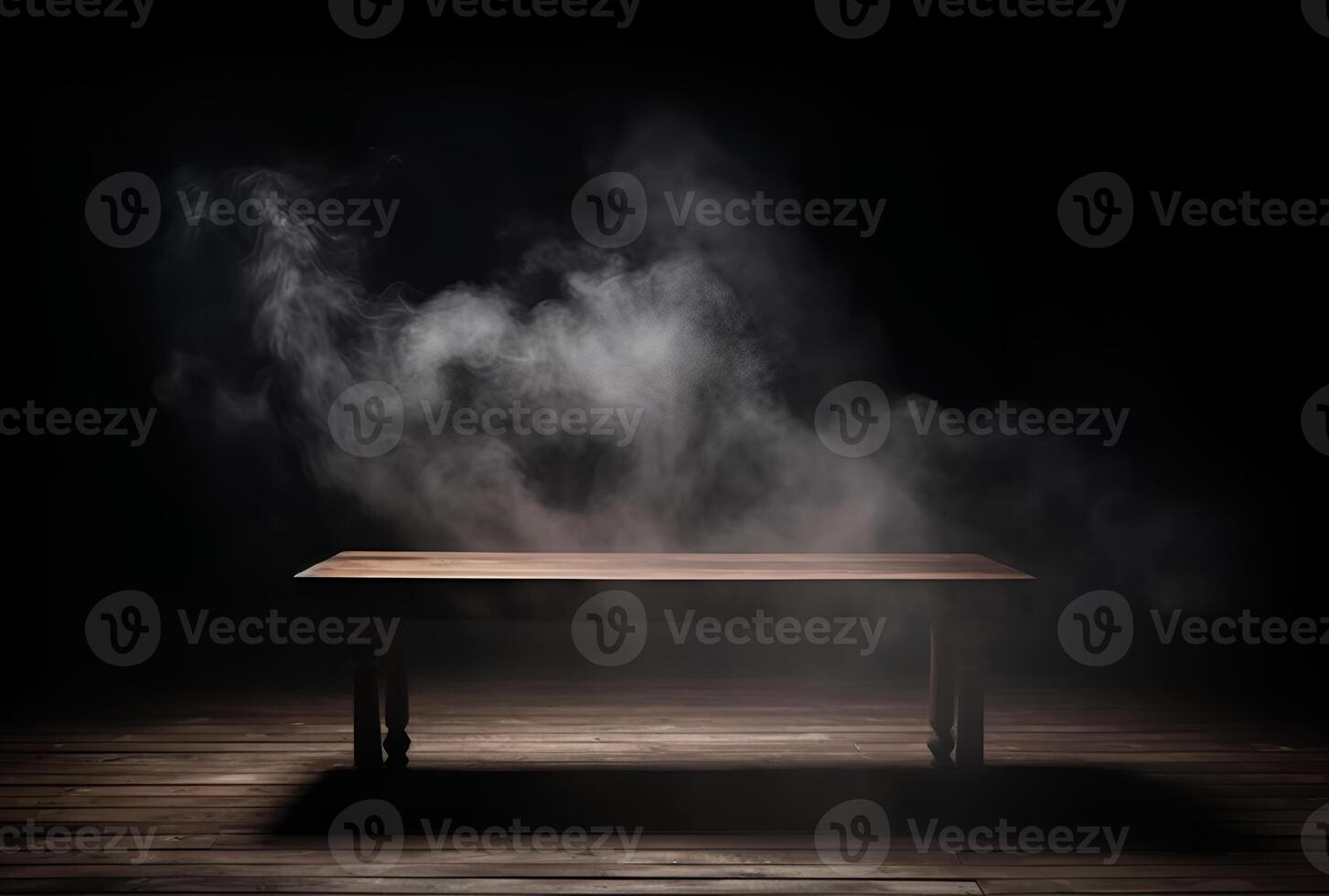 A table with smoke coming out of it and a black background. photo