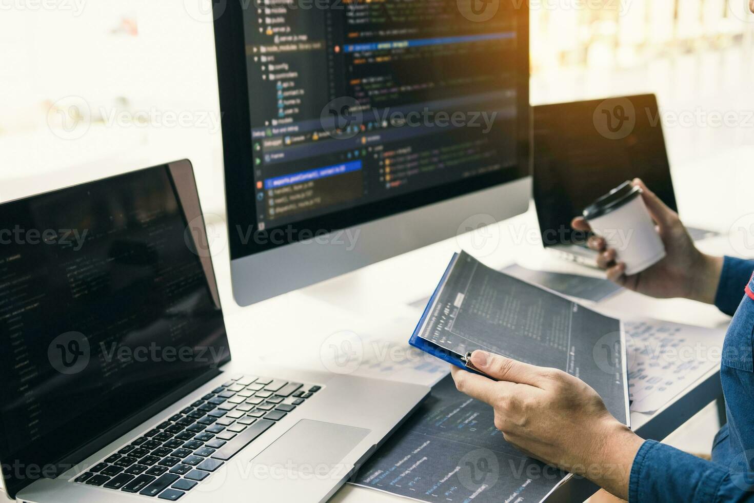 Asian man working code program developer computer web development working design software on desk in office. photo