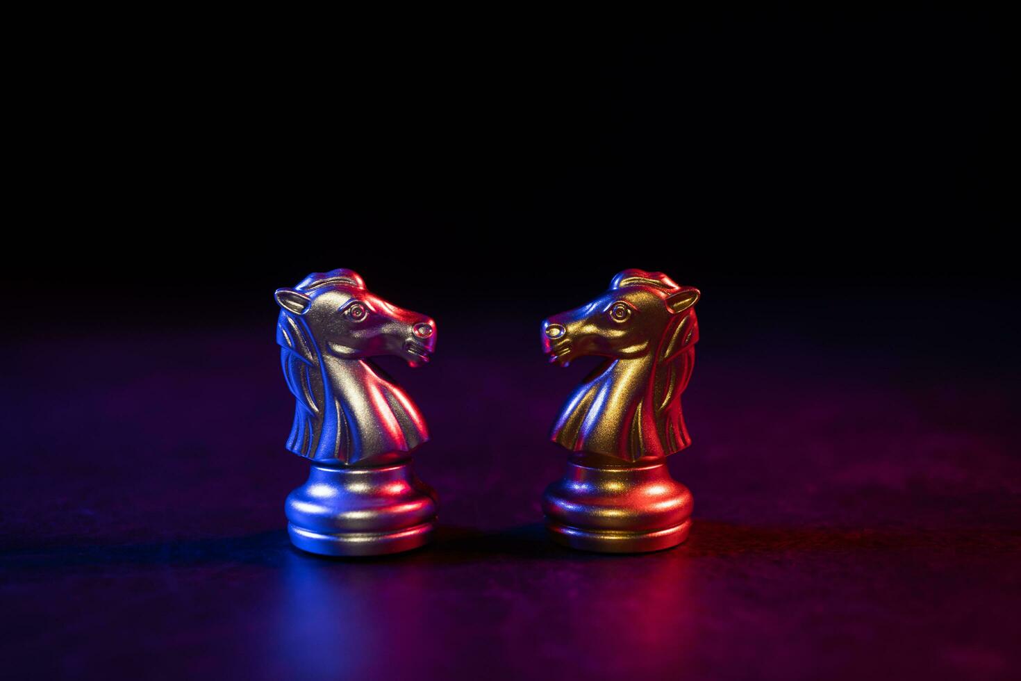 Golden and silver horse chess pieces Invite face to face and There are chess pieces in the background. Concept of competing, leadership and business vision for a win in business games photo