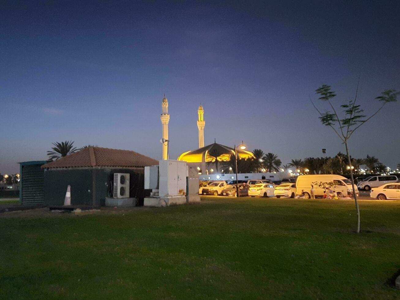 Jeddah, Saudi Arabia, June 2023 - A beautiful night view of the minarets and dome of the Hassan Enany Mosque on the Jeddah Corniche. photo