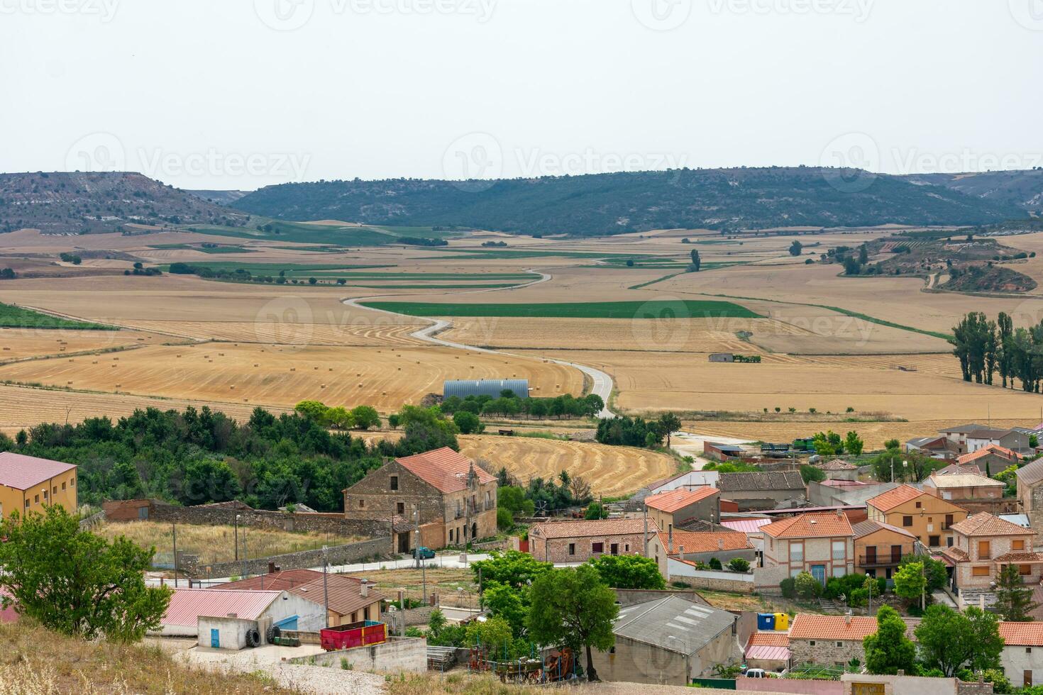 traditional village on the Castilian plateau in Spain with Romanesque Catholic church photo