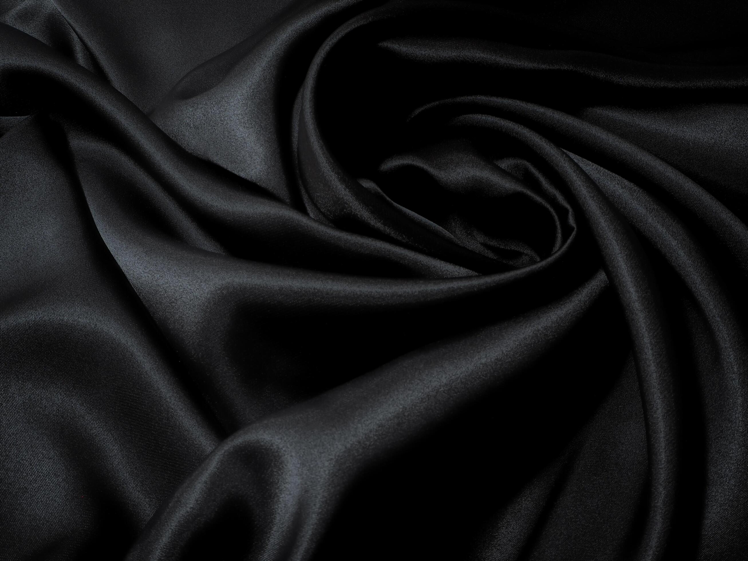black fabric texture, wavy fabric slippery black color, luxury satin