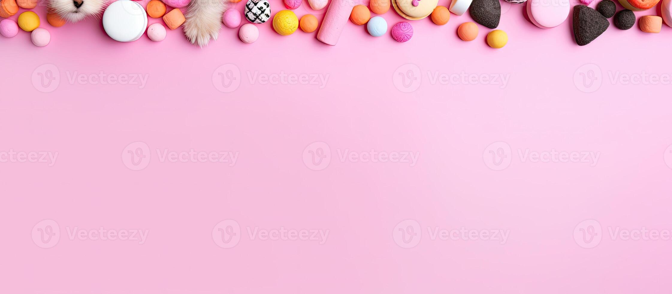 A pink background with lots of candy and candies created with technology photo