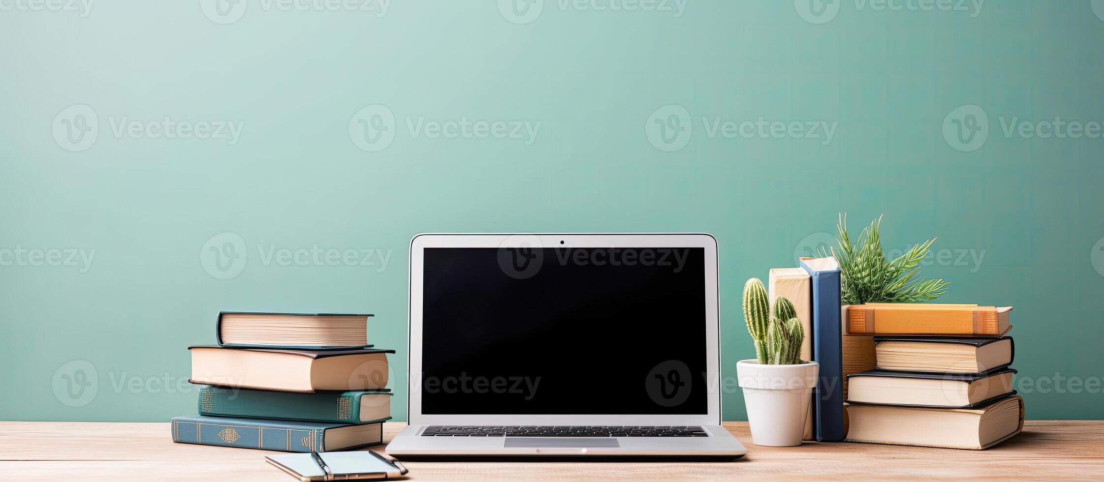 A laptop computer sitting on top of a wooden desk created with technology photo