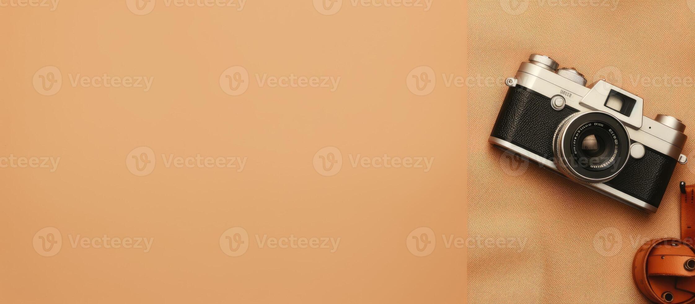 A camera sitting on top of a tan cloth created with technology photo