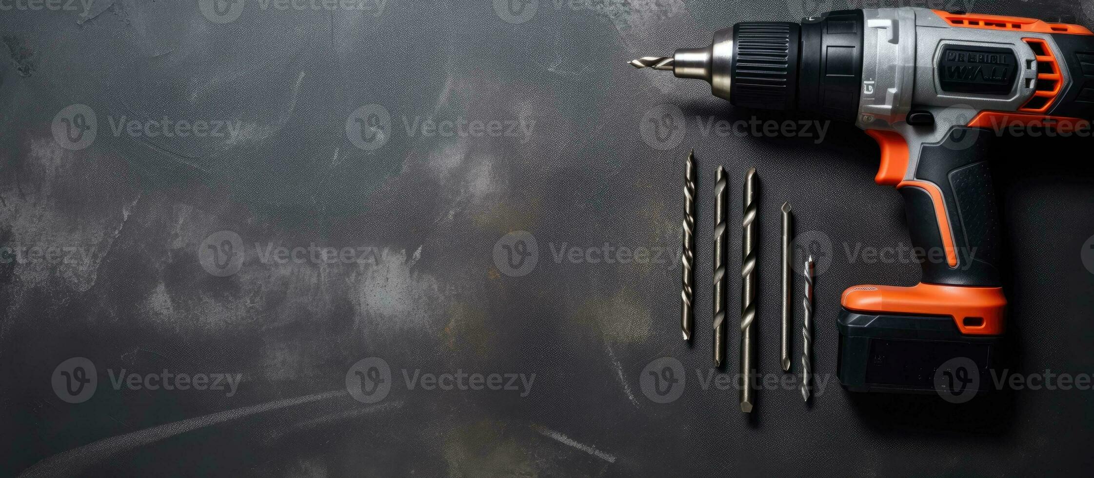 A drill and screwdriver on a black surface created with Generative AI technology photo