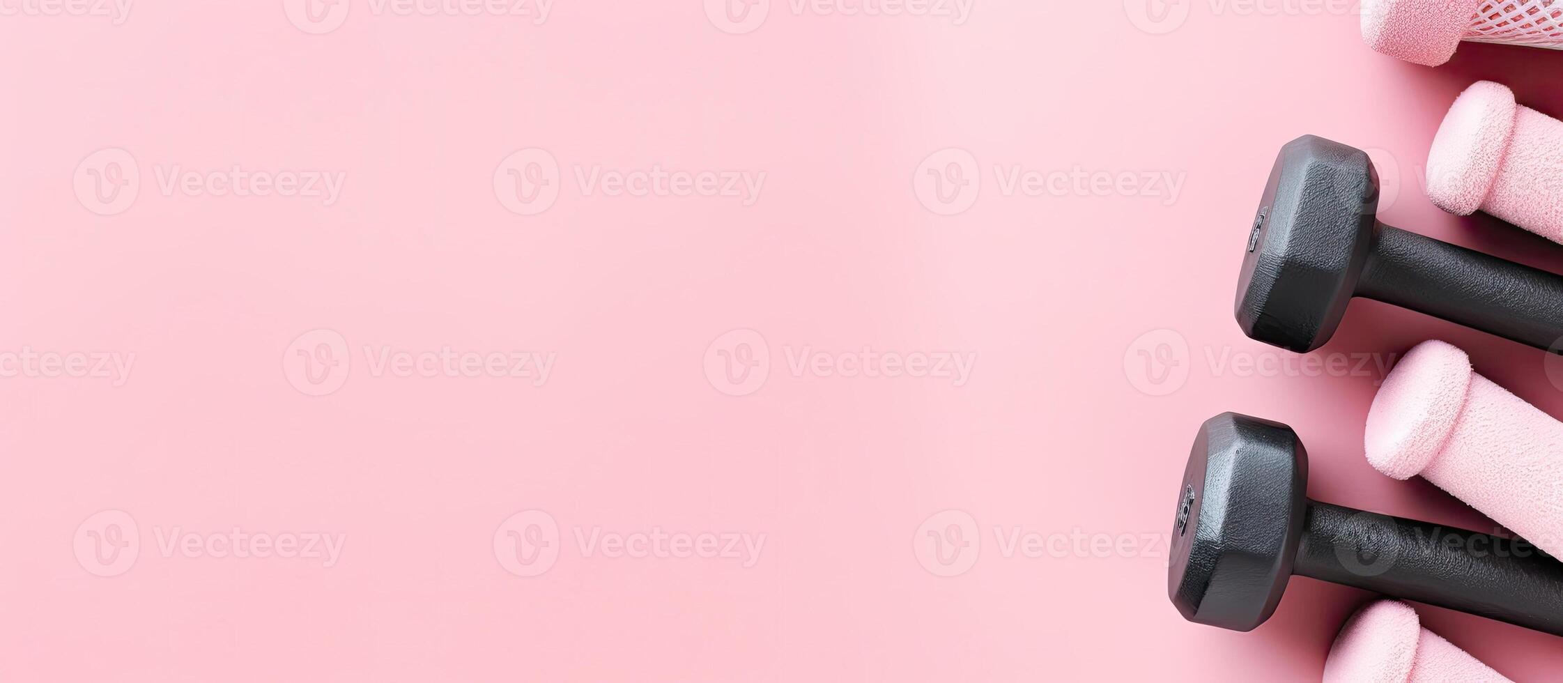 A group of dumbs sitting on top of a pink surface created with technology photo