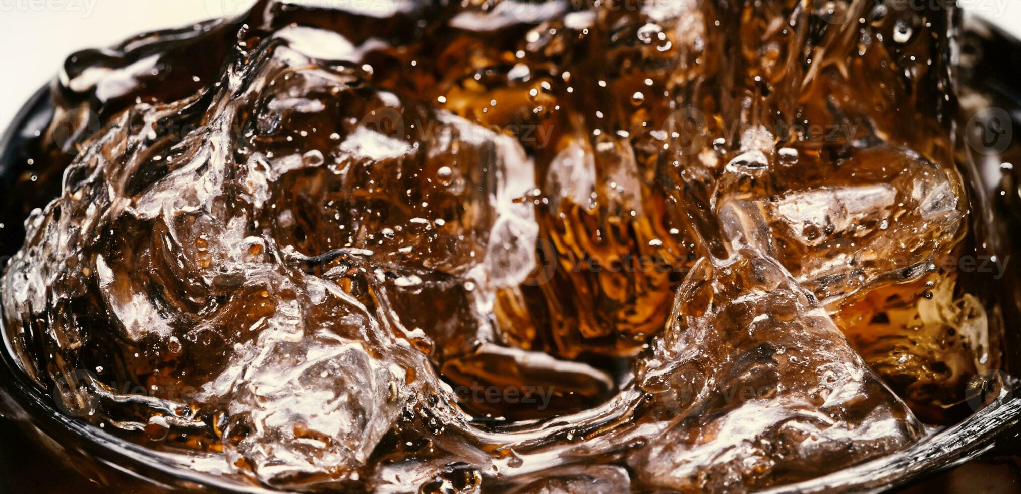 Splashing of Cola and Ice. Cola soda and ice splashing fizzing or floating up to top of surface. Close up of ice in cola water. Texture of carbonate drink with bubbles in glass. Cold drink background photo