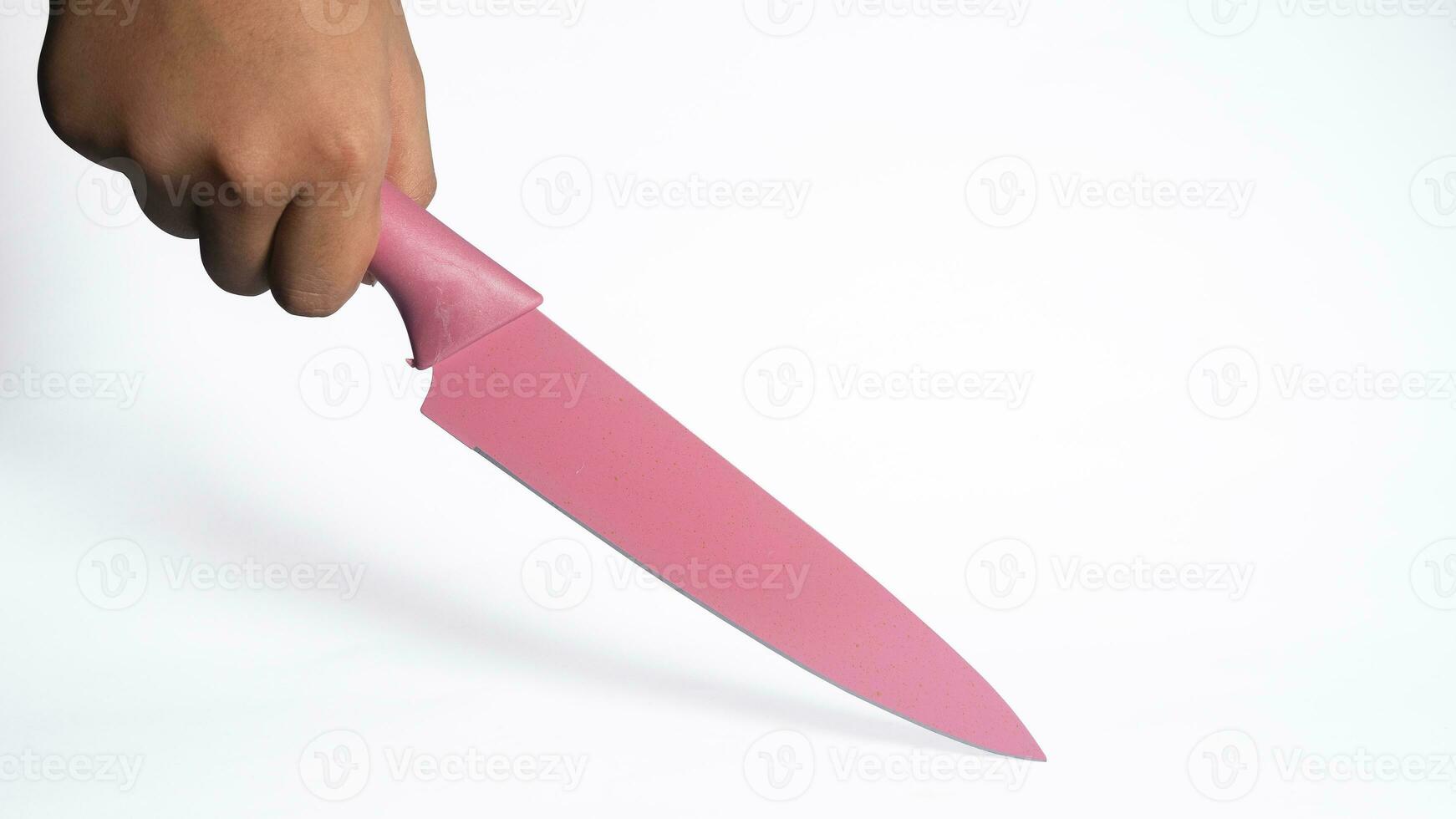 Male hand holding a huge sharp knife photo