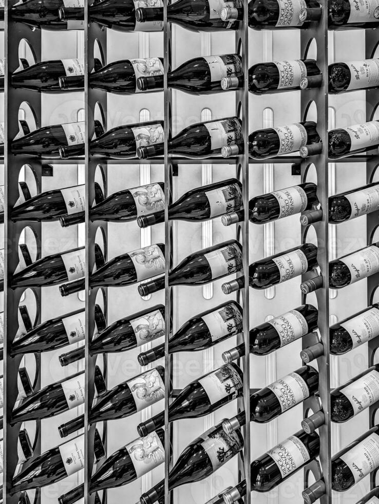 wine bottles on shelf display at the restaurant photo