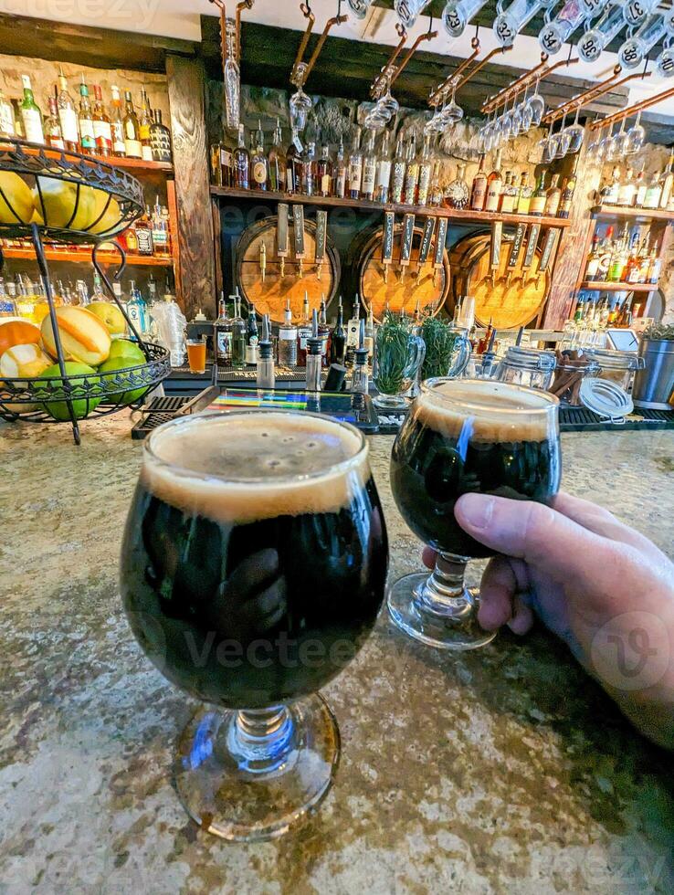 dark stout beer in glass at the brewery photo