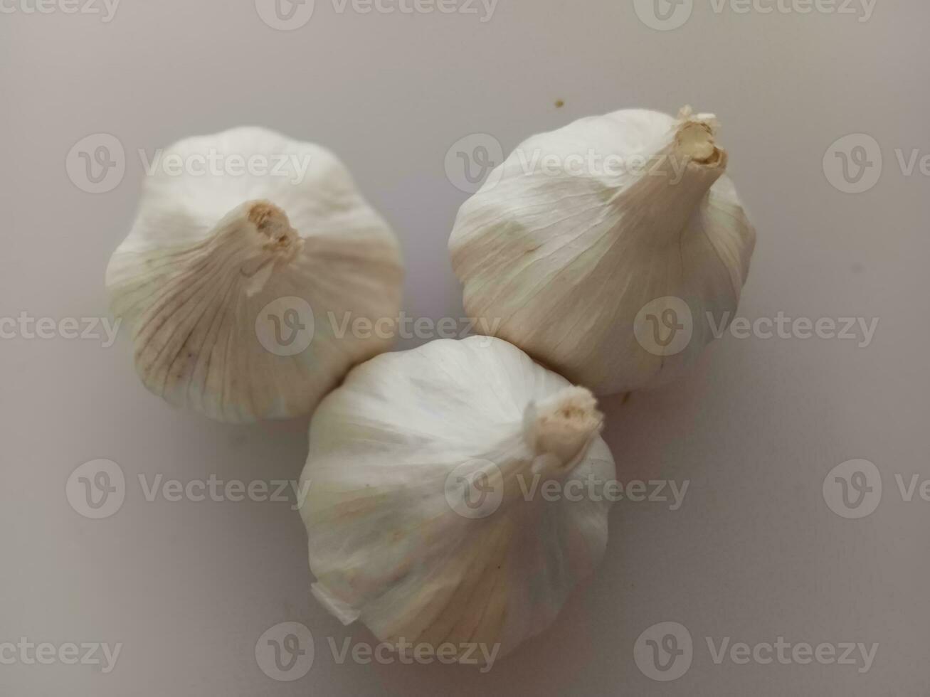 garlic on a white background. Garlic is a spice for cooking. photo