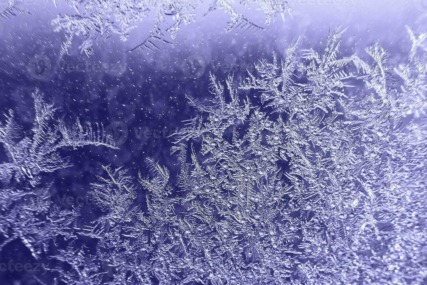 snow pattern on the glass from frost. Very Peri color of the year photo