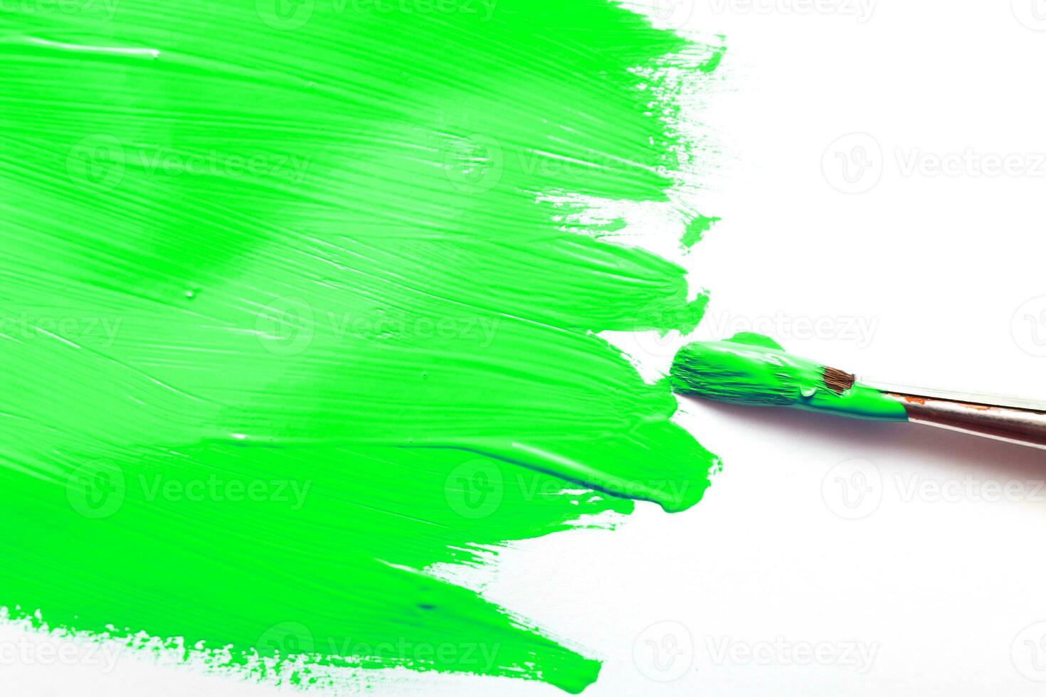 brush with green color and Abstract acrylic green painted spot background. Fluid art texture photo