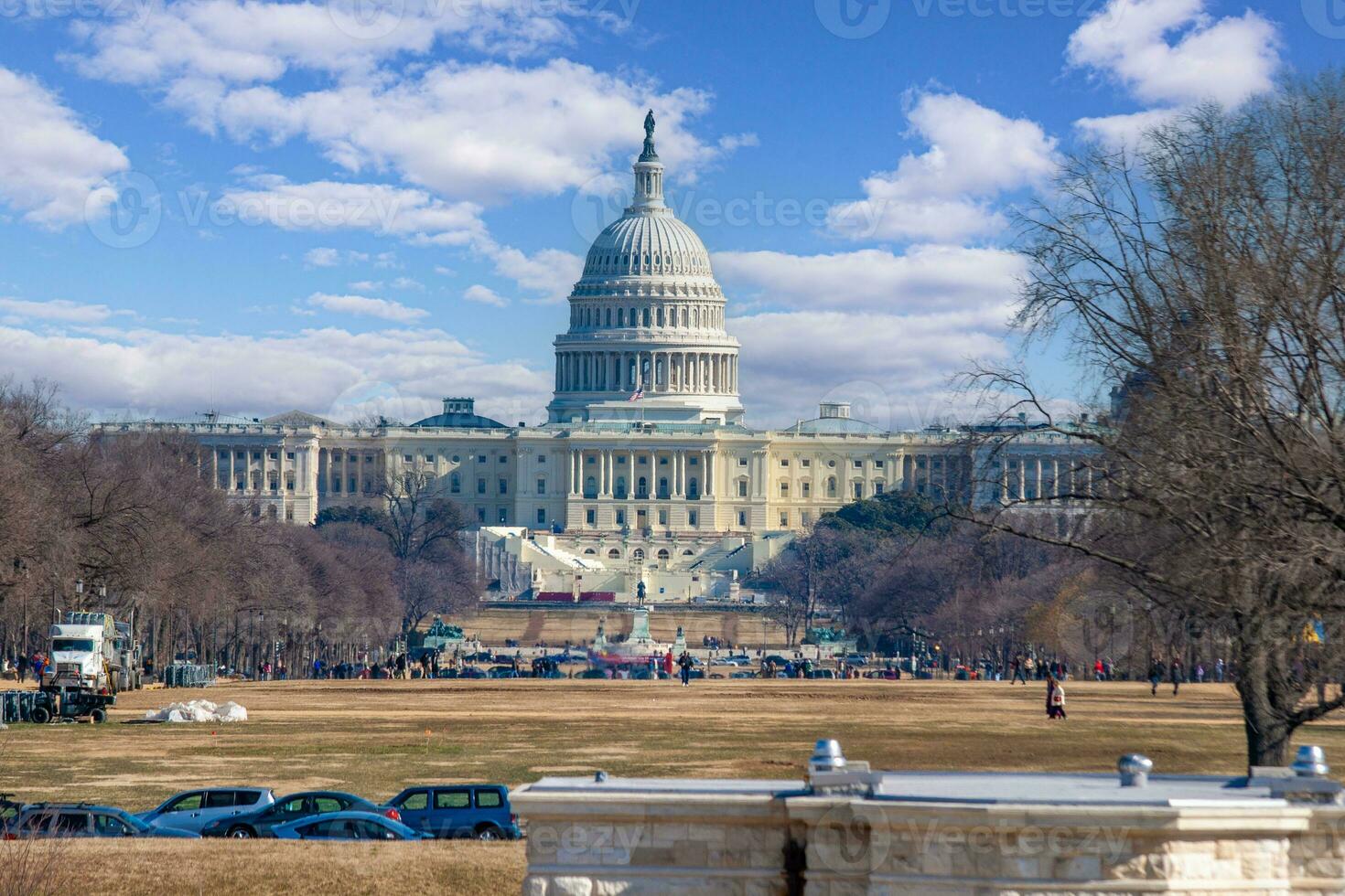 Image of Capitol in Washington against blue sky with white clouds photo