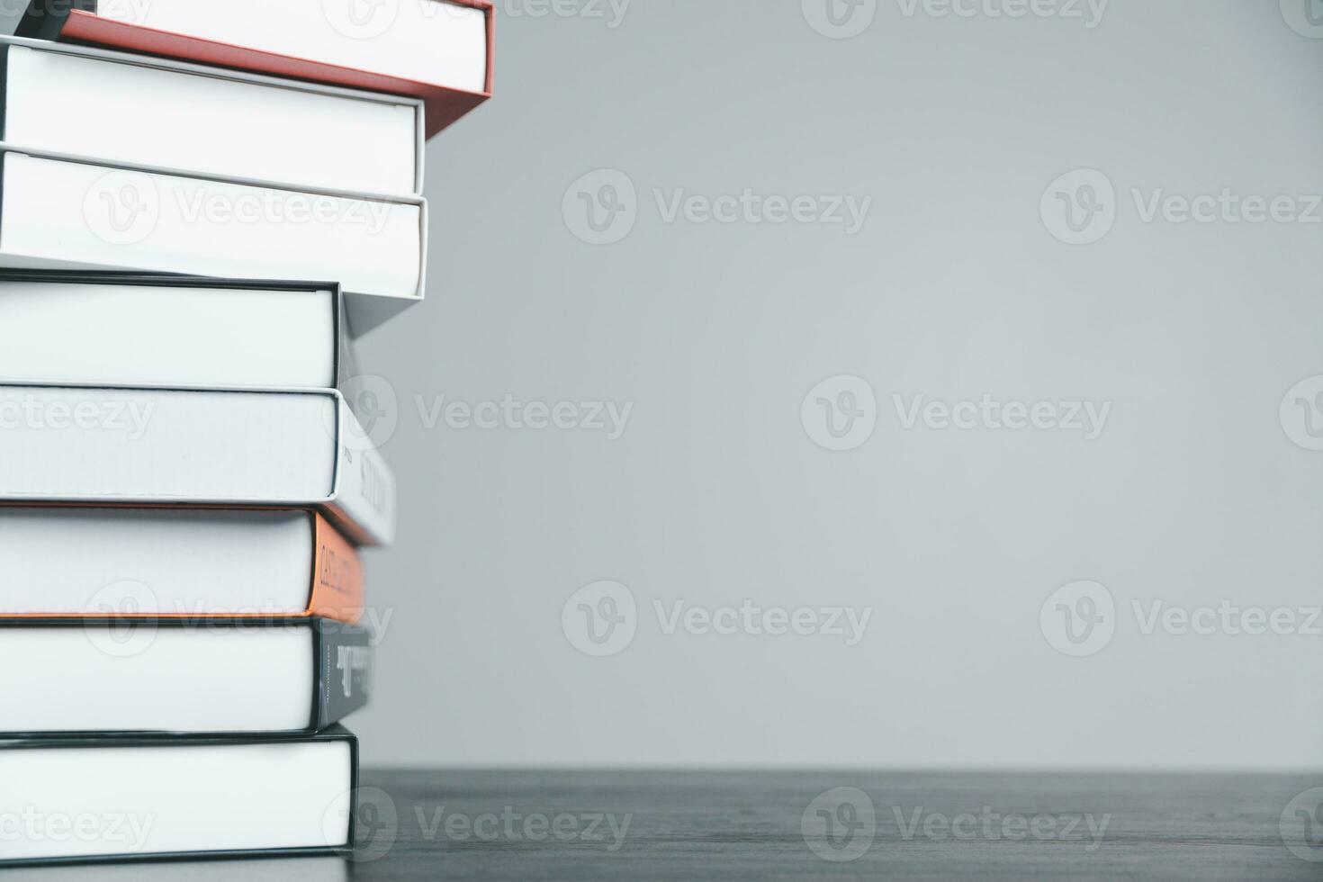 Book stack in the library room and blurred stack book for business and education background, back to school concept. Copy space for text. Distance education, e-learning concept. photo