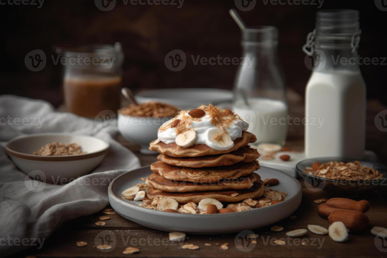 a stack whole wheat pancakes topped with sliced banana photo