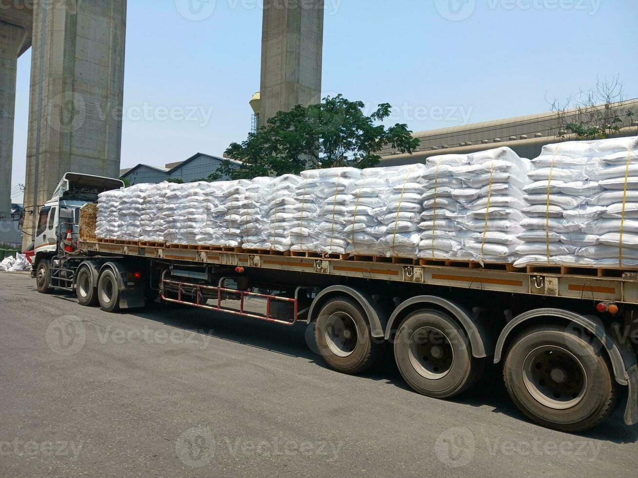 Chemical fertilizer The product stock is packed in sacks, stacked in the warehouse, waiting for delivery. photo