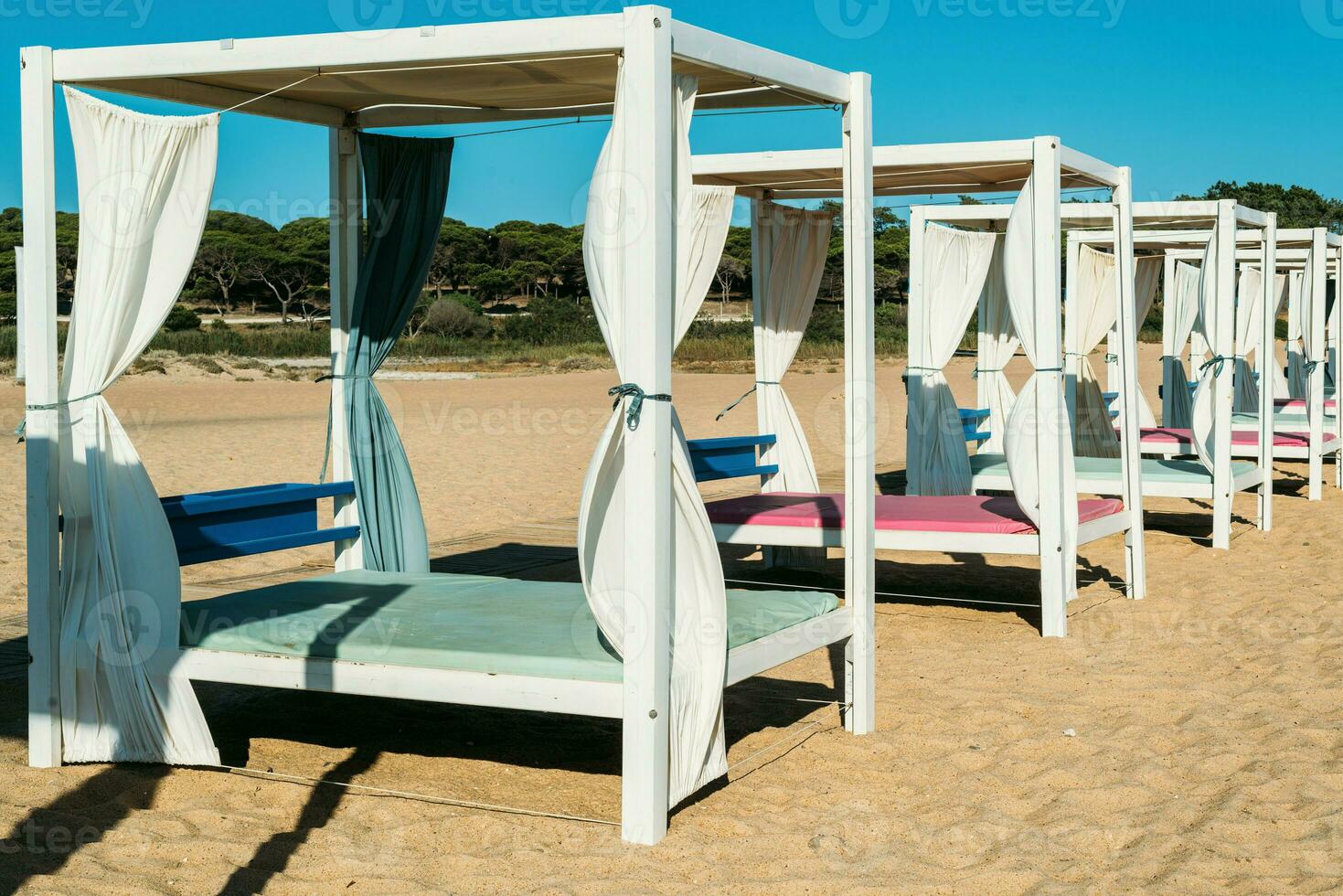 Luxurious sunloungers on the beach at Quarteira, Algarve, Portugal photo