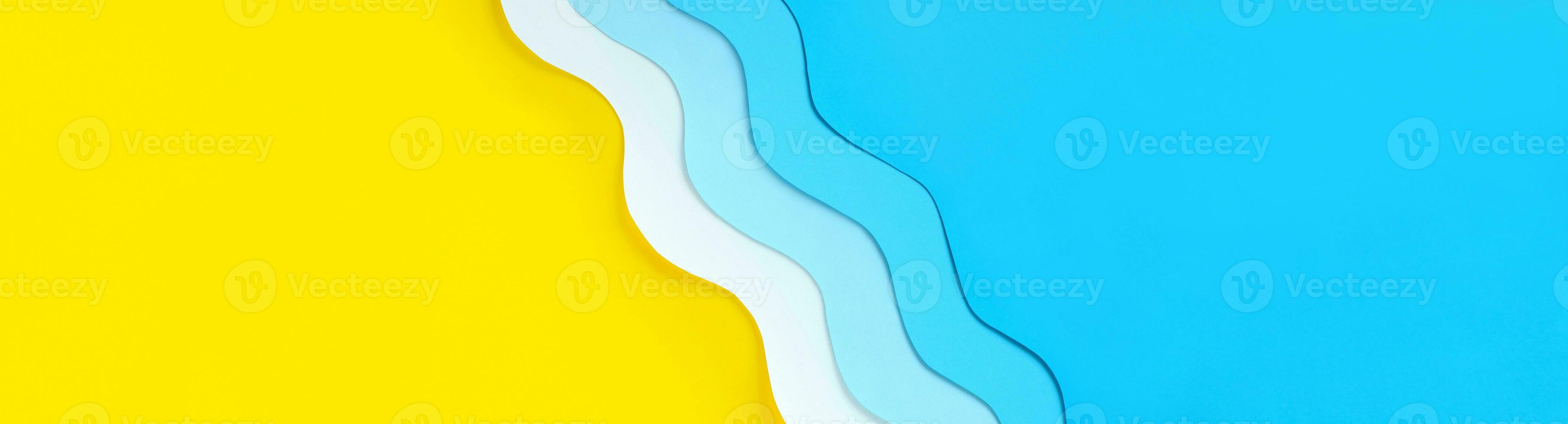 Seashore diagonal long banner with copy space. Summer holidays background with yellow beach sand and paper cut out blue waves. Relaxation on vacations. The ocean coast layout. photo