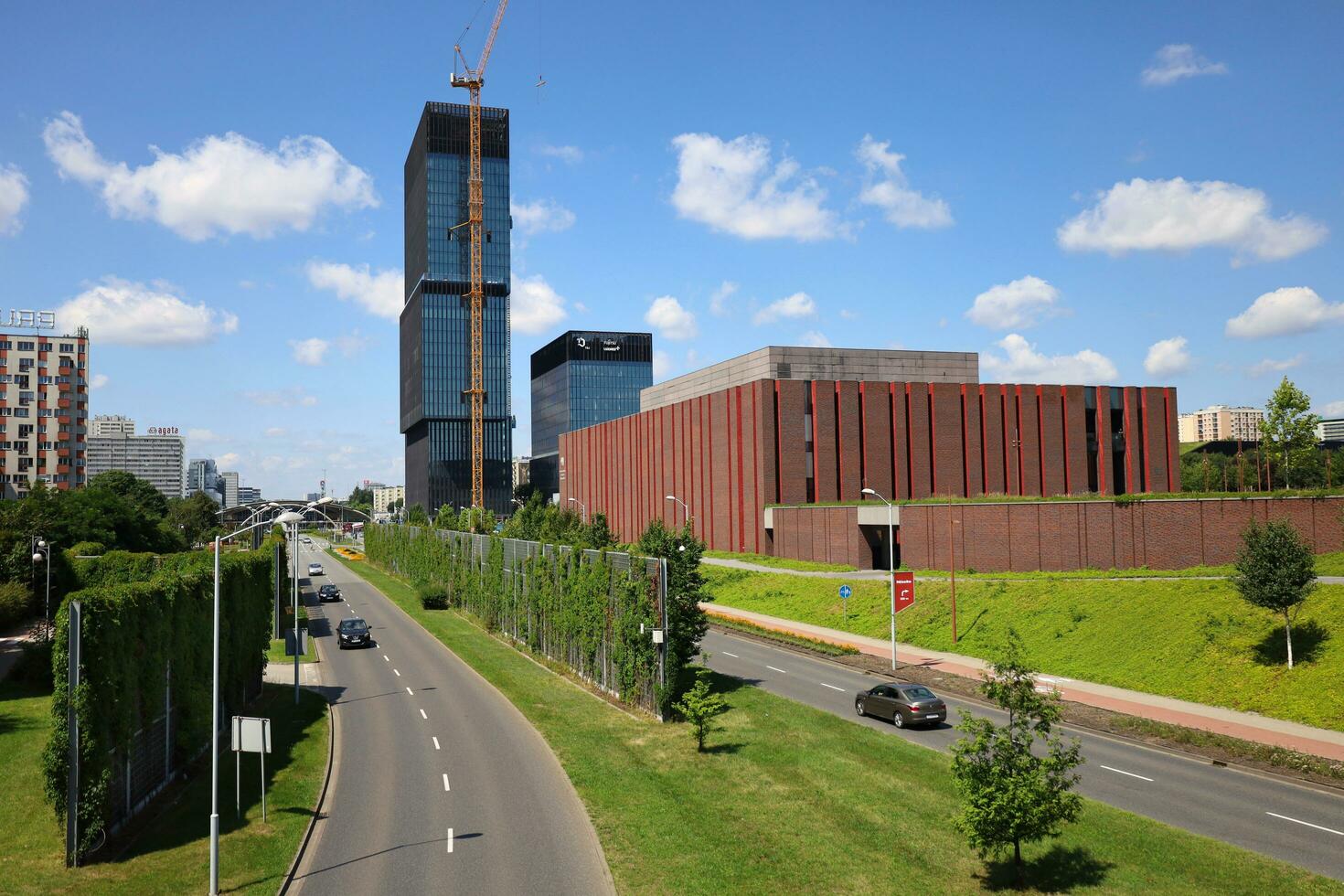 KATOWICE, POLAND, 2021 - View to Walentego Rozdzienskiego Alley on the height of the footbridge. Cityscape, KTW office buildings and Katowice Cultural Zone on the right. Horizontal image. photo