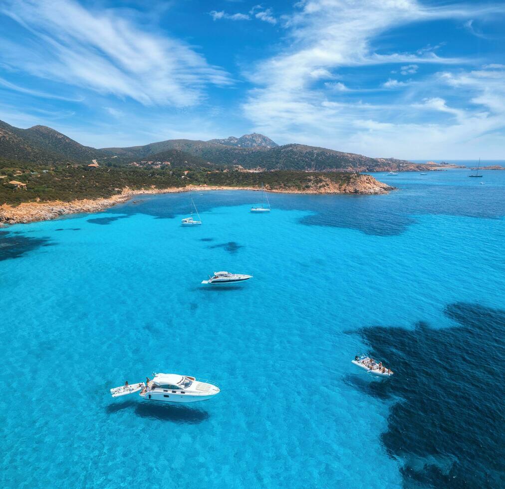 Aerial view of luxury yachts on blue sea at sunny day photo